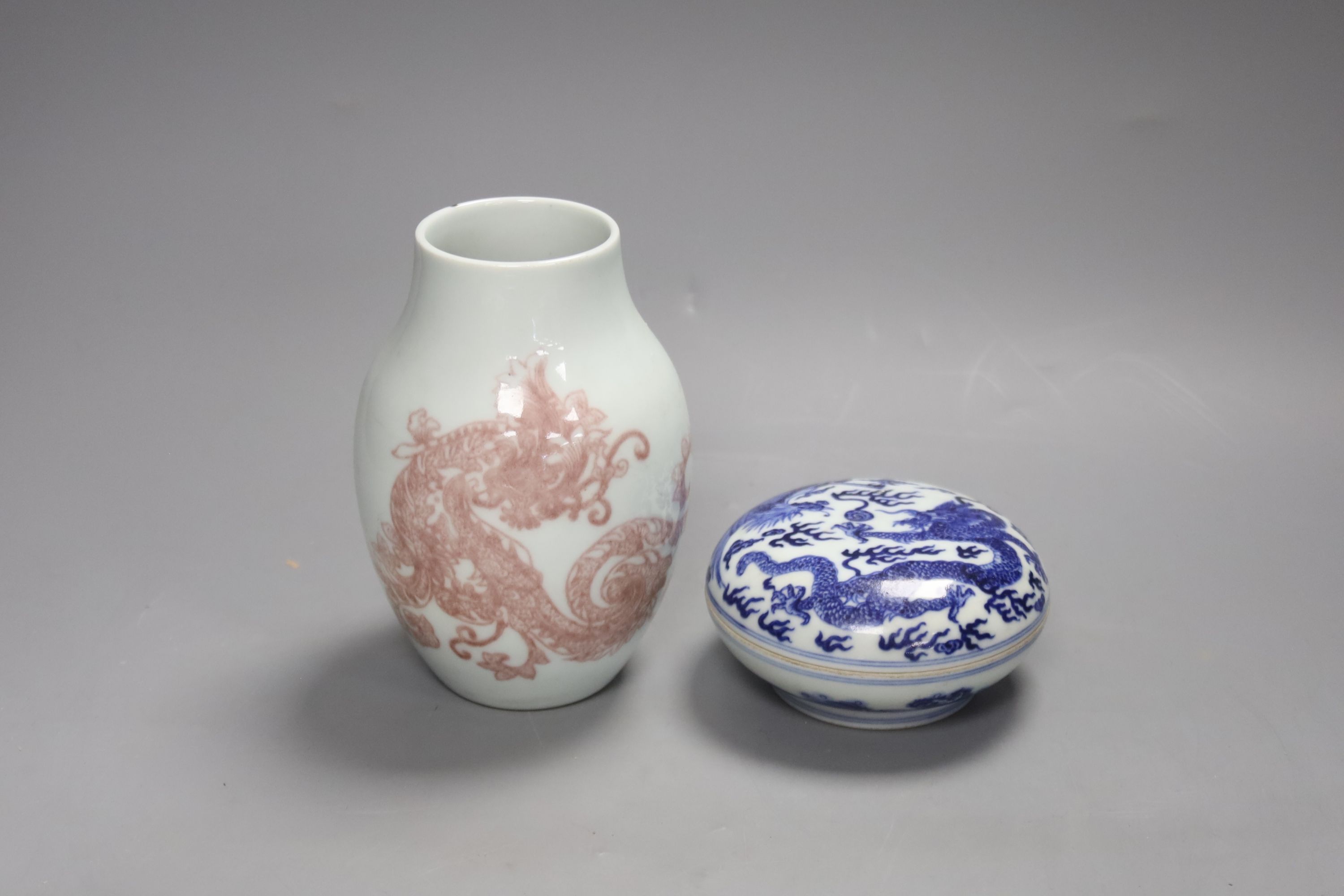 A Chinese underglaze copper red vase and a Chinese blue and white ‘dragon’ box and cover, tallest 15cm